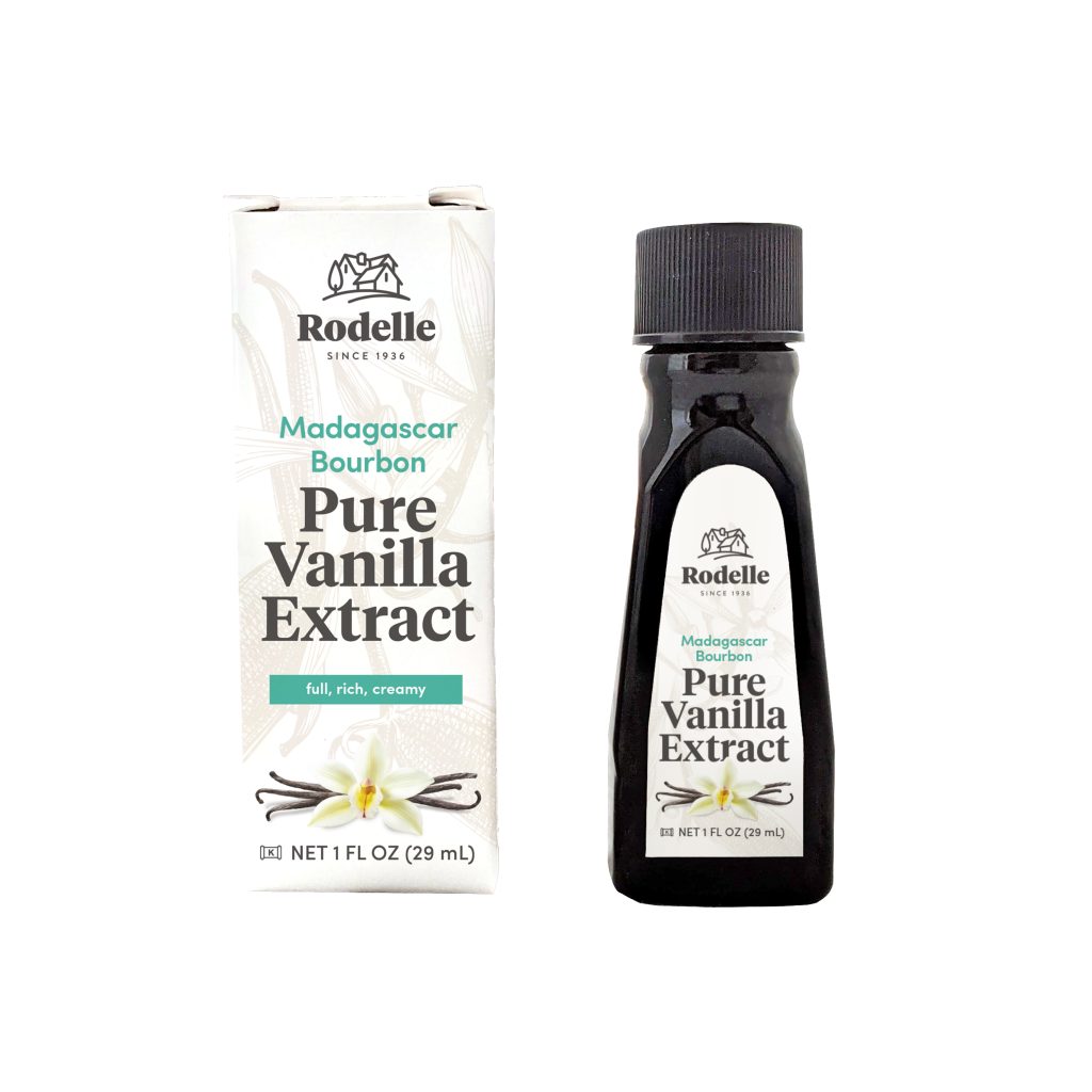 bottle of pure vanilla extract and carton on white background