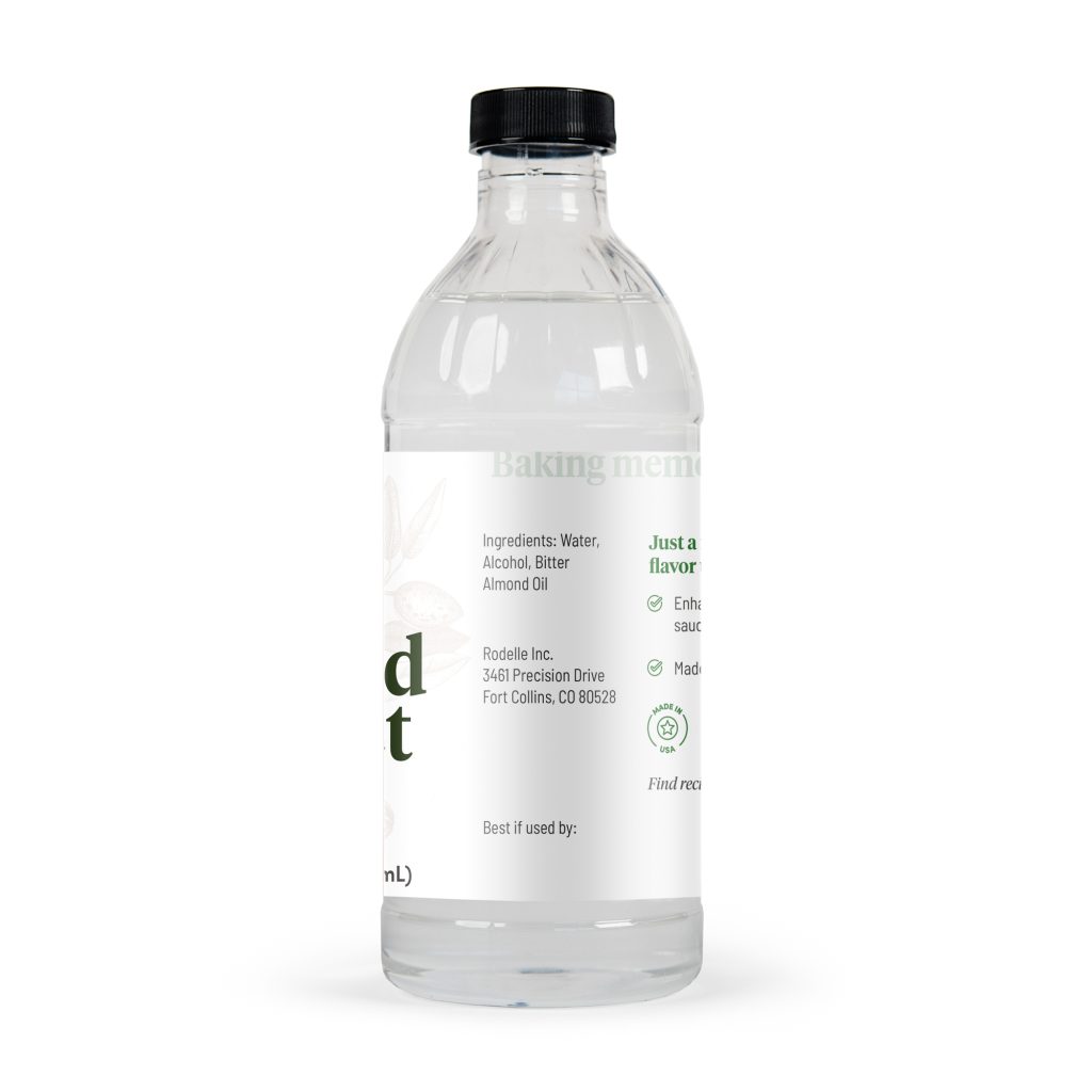 side image of front image of Rodelle 16oz Almond Extract in a round glass bottle showing the ingredient information