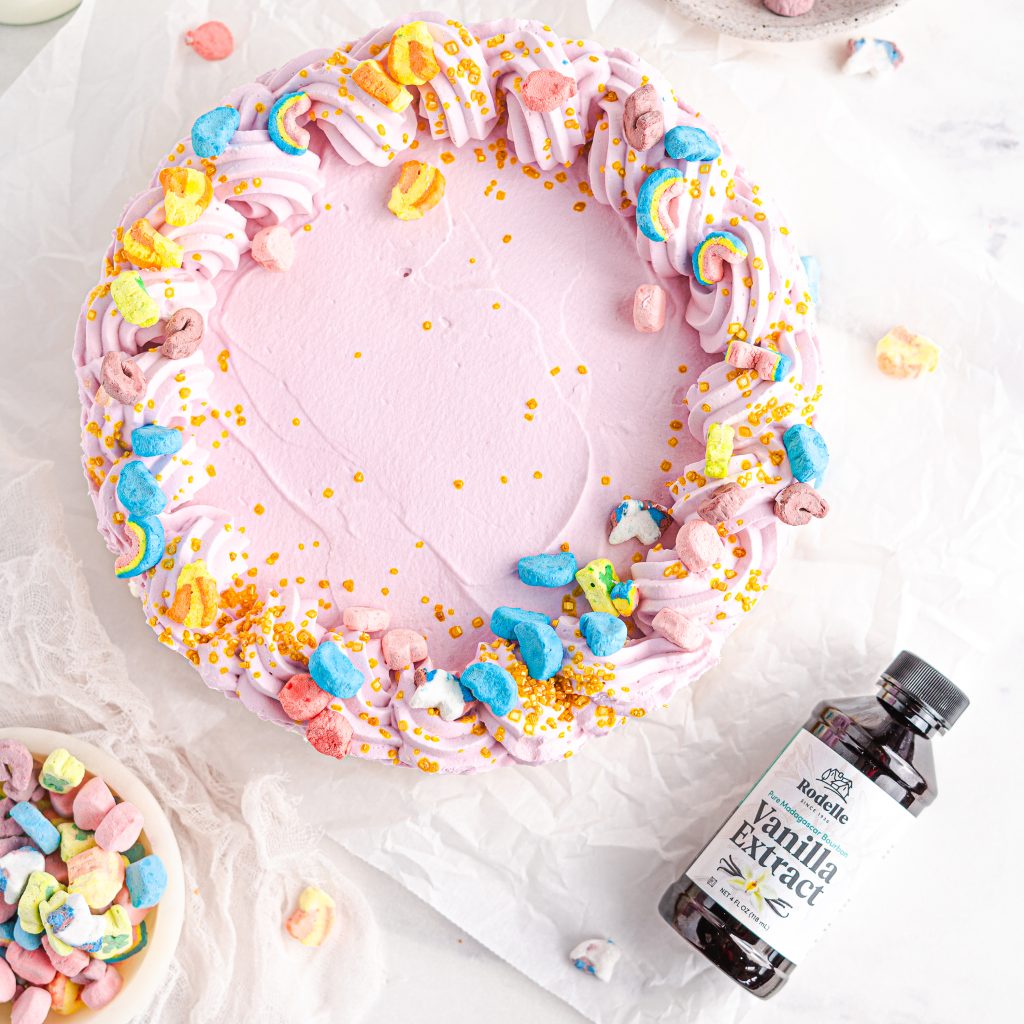 recipe image of Cereal Milk Ice Box Pie in the upper left with lucky charm cereal sprinkled on top. a slice of cake goes of the image in the bottom left and int he bottom right