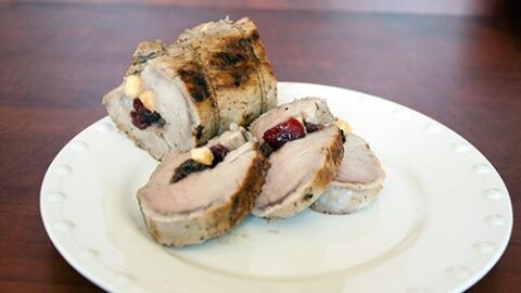 Stuffed brined pork on a white plate
