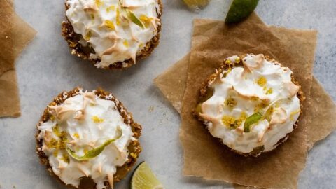 Finished product of the lemon lime tartlets on nice background with slices of lemon and lime