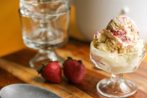 clear glass with strawberry short cake ice cream.