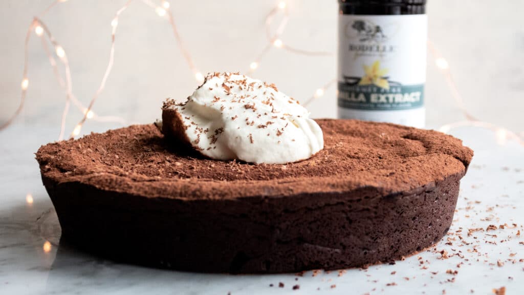 Rodelle Chocolate flourless cake with vanilla in the background