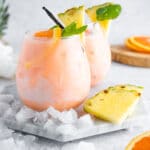vanilla tropical aperol spritz on neutral background