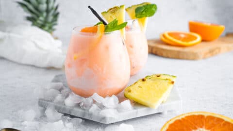 vanilla tropical aperol spritz on neutral background