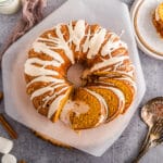 Overhead shot of Marshmallow stuffed sweet potato bundt cake sliced on parchment paper