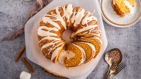 Overhead shot of Marshmallow stuffed sweet potato bundt cake sliced on parchment paper