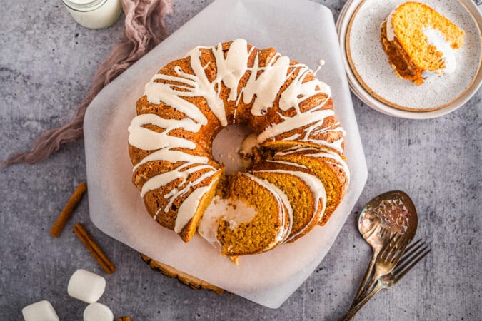 Overhead shot of Marshmallow stuffed sweet potato bundt cake sliced on parchment paper