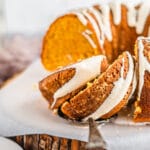 Marshmallow stuffed sweet potato bundt cake sliced on parchment paper
