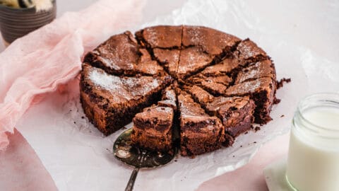 Chocolate Crackly Brownie Cake Sliced on neutral background