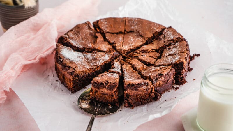 Chocolate Crackly Brownie Cake Sliced on neutral background