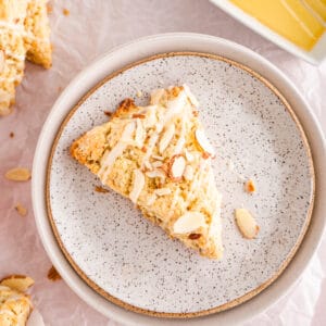 Honey Nut Almond Scone on pottery plate with almond slivers