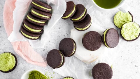 Matcha filled cocoa cookies on neutral background