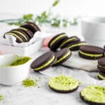 Matcha filled cocoa cookies on neutral background