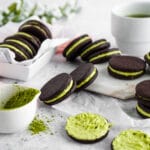 Matcha filled cocoa cookies on neutral background