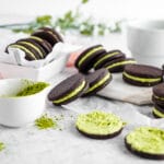 Matcha filled cocoa cookies on neutral background