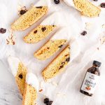 Almond Cherry Biscotti dipped in white chocolate on top of marble background