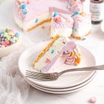 Frozen ice cream pie on a plate with Lucky Charms marshmallows