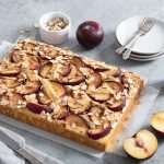 Vanilla plum cake with vanilla paste and plums around