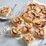 Vanilla plum cake with vanilla paste and plums around