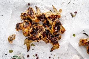 Turkey Brined Chicken Wings plated on a white backdrop