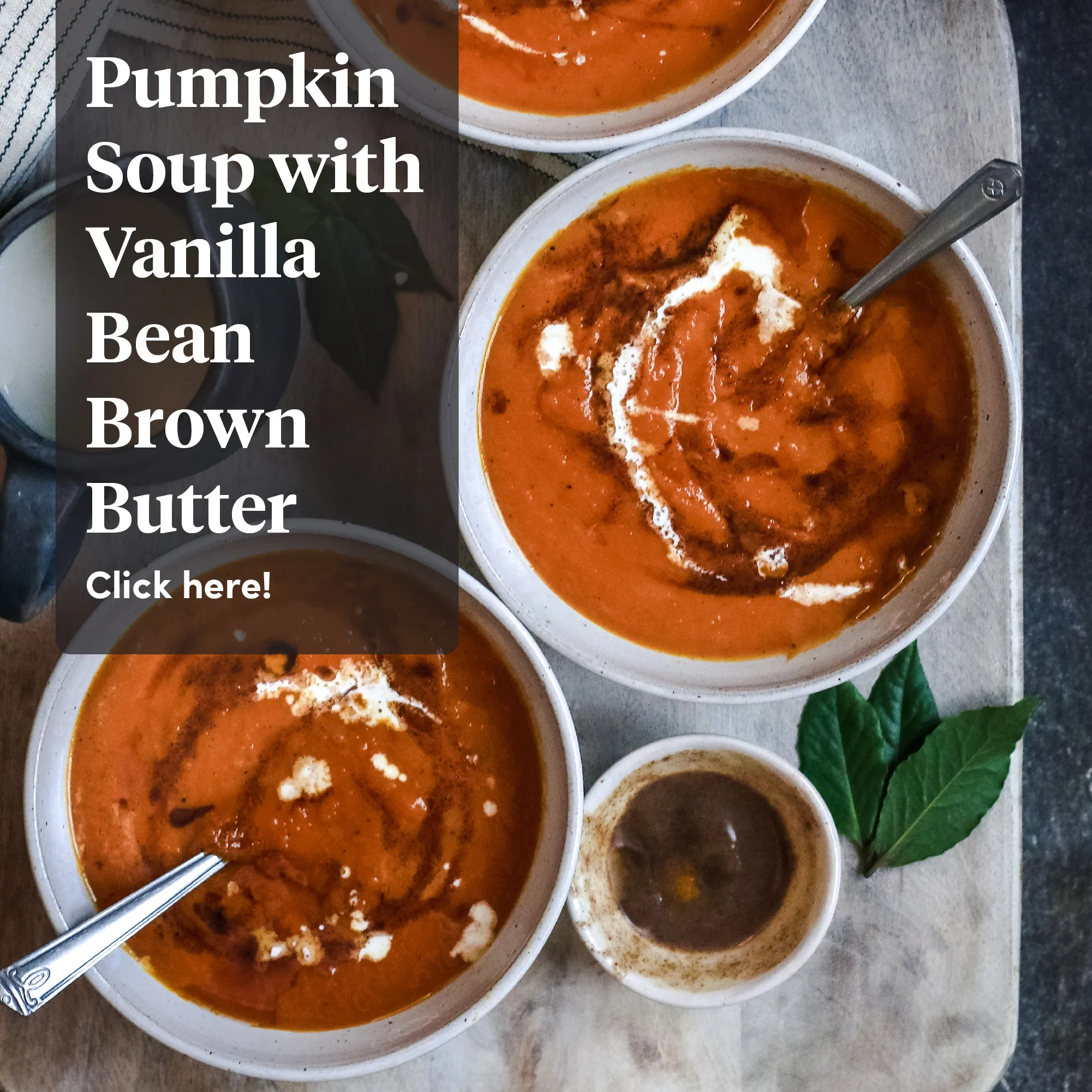 Pumpkin soup with brown butter in white bowls and drizzled with heavy cream