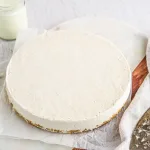 Vanilla cheesecake made with cashews on a white plate