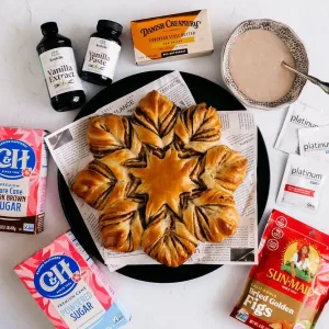 Fig Star Bread with branded product on neutral background