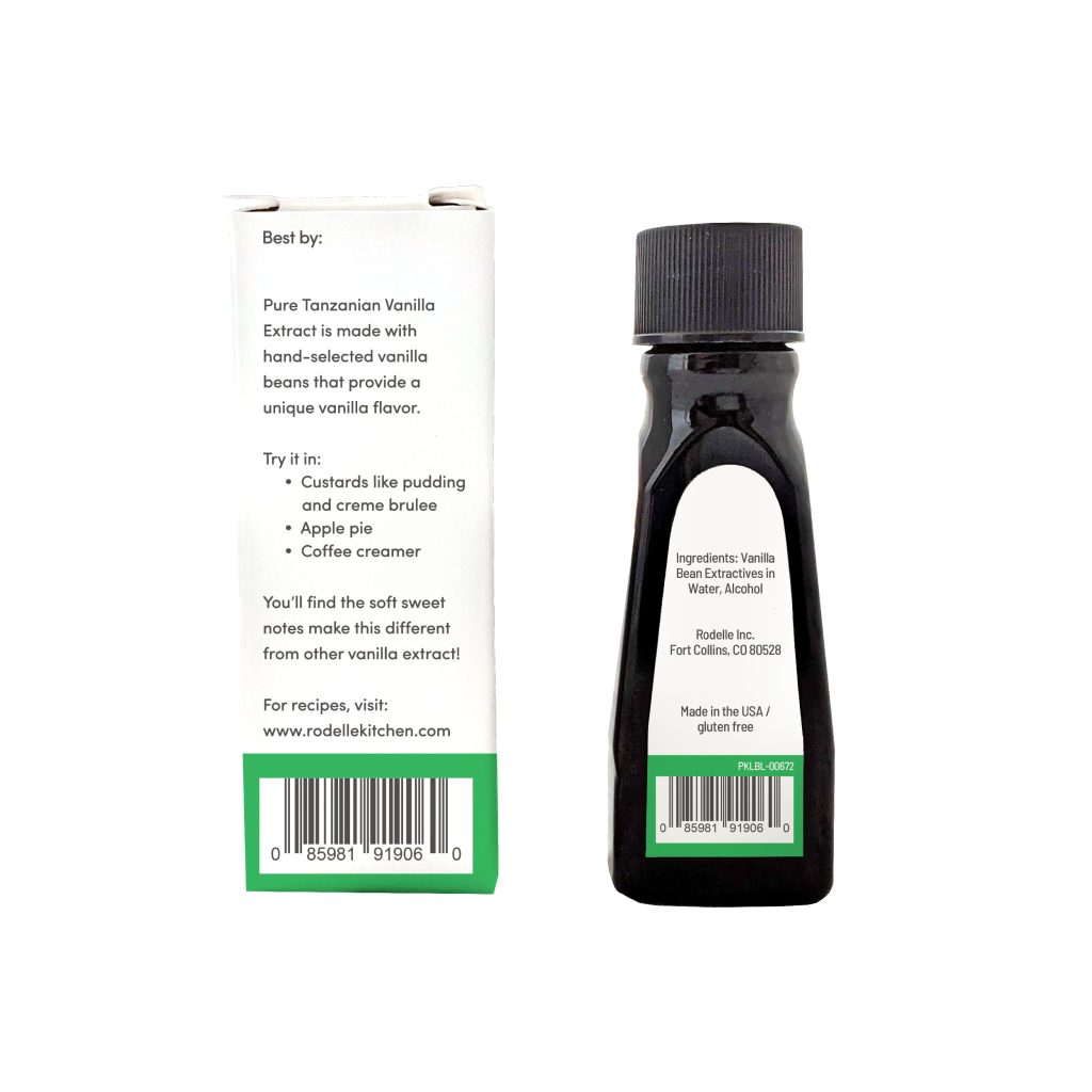 back image of Rodelle's 1oz Tanzania Pure Vanilla Extract bottle to the right and box to the left