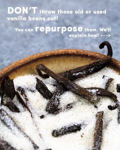 close up of vanilla beans in a bowl of sugar